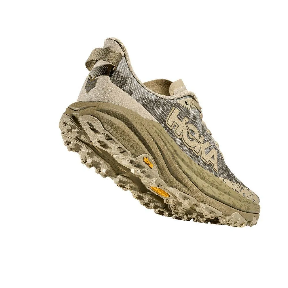 running in a baseball field area shoes running in an obstacle course race HOKA SPEEDGOAT 6
