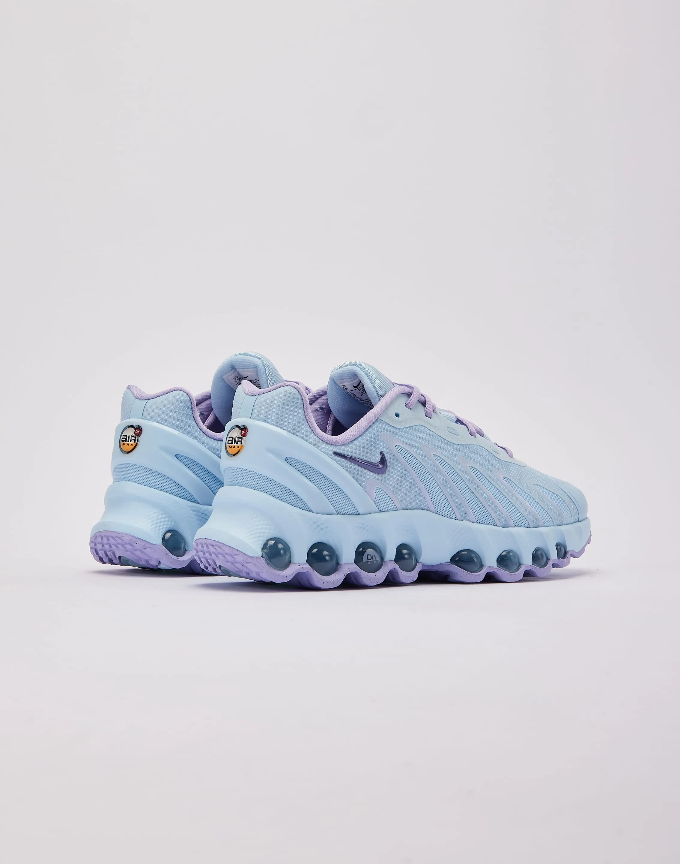 Nike Air Max Dn8 Grade-School Walker running in a nature reserve shoes